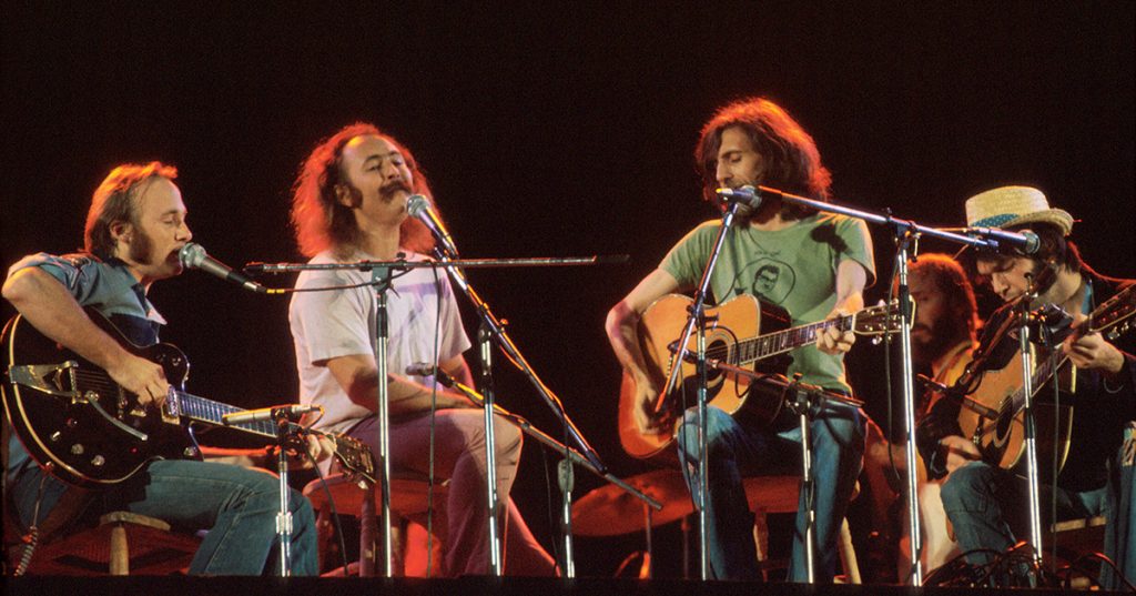 Crosby Stills Nash and Young perform on stage at Wembley Stadium, London, 14th September 1974, L-R Stephen Stills, David Crosby, Graham Nash, Neil Young. (Photo by Michael Putland/Getty Images)